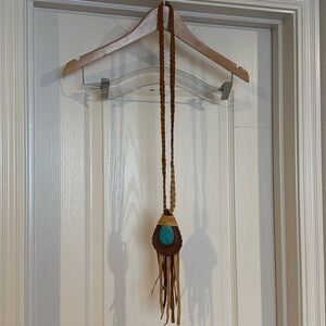 Costume Jewelry with leather fringe.